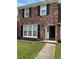Charming two-story brick home featuring a well-manicured lawn and welcoming front entrance at 4324 Purdue Dr, North Charleston, SC 29418