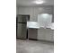 This kitchen boasts modern stainless steel appliances, a bright white backsplash, and plenty of storage space at 4324 Purdue Dr, North Charleston, SC 29418