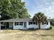 Charming single-story brick home featuring a manicured lawn and mature trees at 4626 W W Montague Ave, North Charleston, SC 29418