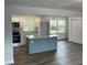Bright, open kitchen with island, modern appliances, and ample counter space at 4626 W W Montague Ave, North Charleston, SC 29418