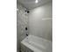 Bathroom shower with updated fixtures at 4626 W W Montague Ave, North Charleston, SC 29418
