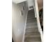 Carpeted stairway with white railings, leading to the upper level at 4652 Nibbs Ln, North Charleston, SC 29418