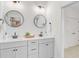 Elegant bathroom featuring double vanity with framed mirrors and modern fixtures at 503 Ivy Green Ln, Summerville, SC 29486