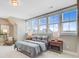 Bright bedroom with large windows and a bed between matching nightstands with table lamps at 503 Ivy Green Ln, Summerville, SC 29486