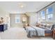 Spacious bedroom with large windows, comfortable bed, sitting area, and a classic dark wood dresser at 503 Ivy Green Ln, Summerville, SC 29486