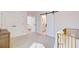 Bedroom featuring barn door to bathroom, closet doors, a gold crib, and soft, neutral decor at 503 Ivy Green Ln, Summerville, SC 29486