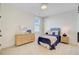 Nautical themed bedroom with accent wall, twin bed, and woven dresser at 503 Ivy Green Ln, Summerville, SC 29486