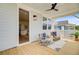 Covered deck with a seating area, ceiling fan, and view of the interior at 503 Ivy Green Ln, Summerville, SC 29486