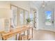 Bright foyer with a wooden console table, modern art, and hardwood floors at 503 Ivy Green Ln, Summerville, SC 29486