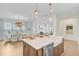 Kitchen island includes sink and dishwasher and is open to the breakfast room and living area at 503 Ivy Green Ln, Summerville, SC 29486