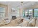 Bright living room with fireplace, coffered ceilings, and a sliding door that opens to the patio at 503 Ivy Green Ln, Summerville, SC 29486