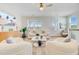 Bright living room featuring neutral decor, hardwood floors, a ceiling fan, and lots of natural light at 503 Ivy Green Ln, Summerville, SC 29486