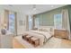 Bright and spacious main bedroom with hardwood floors and neutral decor with views to the exterior at 503 Ivy Green Ln, Summerville, SC 29486