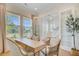 Bright office with large windows, french doors, and stylish furnishings overlooking the landscaped yard at 503 Ivy Green Ln, Summerville, SC 29486