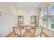 Bright home office with ample natural light, wood floors, wainscoting and neutral decor at 503 Ivy Green Ln, Summerville, SC 29486