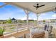 Covered porch showcasing outdoor seating with a scenic view of the community at 503 Ivy Green Ln, Summerville, SC 29486