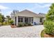 The backyard patio is accessible from the house through sliding glass doors and leads to the brick-paved pathway at 512 Pontoon Rd, Huger, SC 29450