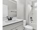 Clean bathroom featuring a modern vanity, black hardware, and a shower-tub combination at 512 Pontoon Rd, Huger, SC 29450