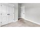 Spacious bedroom with neutral carpet, double doors to a closet and a single door at 512 Pontoon Rd, Huger, SC 29450