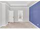 Bedroom with an attached closet and blue accent wall. The room offers great space at 512 Pontoon Rd, Huger, SC 29450