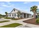 Exterior of community clubhouse with beautiful landscaping, bike racks, and a reserved parking sign at 512 Pontoon Rd, Huger, SC 29450