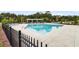 Inviting community pool with comfortable lounge chairs and umbrellas, perfect for relaxation and recreation at 512 Pontoon Rd, Huger, SC 29450