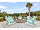 Cozy fire pit area with comfortable seating, perfect for gatherings and relaxing outdoors at 512 Pontoon Rd, Huger, SC 29450