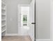 Bright hallway shows tile flooring, a view to a window and an open doorway for easy access at 512 Pontoon Rd, Huger, SC 29450
