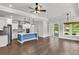 Bright open-concept kitchen and living area with hardwood floors and abundant natural light at 512 Pontoon Rd, Huger, SC 29450