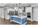 Modern kitchen with a large island, stainless steel appliances, and white cabinets with modern hardware at 512 Pontoon Rd, Huger, SC 29450