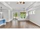 Bright living room featuring hardwood floors, many windows, ceiling fan, and slider to the patio at 512 Pontoon Rd, Huger, SC 29450