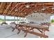 Interior of community pavilion featuring picnic tables and lake views at 512 Pontoon Rd, Huger, SC 29450