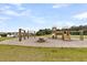 Fun playground area with swings, slides, and a picnic table, creating a perfect play space at 512 Pontoon Rd, Huger, SC 29450