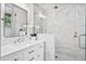 Modern bathroom featuring marble tile in the shower, a glass shower door, and a vessel sink with modern faucet at 520 Yale Dr, Charleston, SC 29412