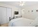 Cozy bedroom boasts a ceiling fan, closet, dresser with a television, and is decorated with lovely pictures at 520 Yale Dr, Charleston, SC 29412