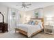 Bright bedroom featuring a rattan bed frame, decorative pillows, and bedside tables at 520 Yale Dr, Charleston, SC 29412