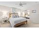 Inviting bedroom with a rattan bed frame, mirrored closet, and soft, neutral colors at 520 Yale Dr, Charleston, SC 29412