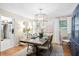 Elegant dining room with a rustic wood table, modern chandelier, and neutral decor at 520 Yale Dr, Charleston, SC 29412