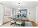Charming dining area featuring a wooden table, stylish decor, and a blue accent cabinet at 520 Yale Dr, Charleston, SC 29412