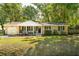 Lovely brick home with a one-car garage, black shutters, and well-kept lawn at 520 Yale Dr, Charleston, SC 29412