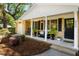 Inviting front porch with rocking chair and bench, enhanced by landscaped plants for a welcoming curb appeal at 520 Yale Dr, Charleston, SC 29412