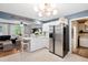 Modern kitchen with white cabinets, stainless steel appliances, and a breakfast bar, open to the living area at 520 Yale Dr, Charleston, SC 29412