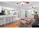 Inviting living area featuring hardwood floors, ceiling fan, and an open concept connecting to the kitchen at 520 Yale Dr, Charleston, SC 29412