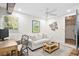 Cozy living area featuring a ceiling fan, rustic wooden accents, and comfortable seating at 520 Yale Dr, Charleston, SC 29412