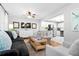 Open-concept living room flows into a kitchen with a breakfast bar, offering a cohesive and modern living space at 520 Yale Dr, Charleston, SC 29412