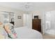 Bright main bedroom features neutral walls, ceiling fan, dresser, and an en suite bathroom with a walk-in shower at 520 Yale Dr, Charleston, SC 29412