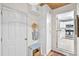 Functional mudroom entrance with storage cabinets, seating, and access to the kitchen at 520 Yale Dr, Charleston, SC 29412