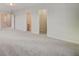 Spacious bedroom with plush carpeting, open doorways, and a closet at 533 Verdi Dr, Summerville, SC 29486