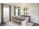 Elegant dining room with modern chandelier, stylish decor, and plush rug at 543 Verdi Dr, Summerville, SC 29486
