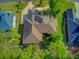 Stunning aerial view of home with circular driveway, mature trees, and well-manicured lawn at 5433 Clearview Dr, North Charleston, SC 29420